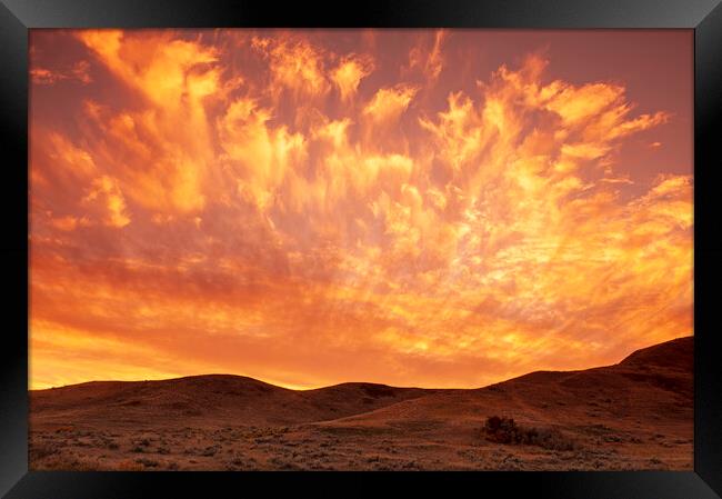 Sunset Over the Badlands Framed Print by Dave Reede