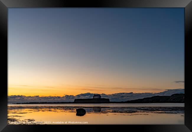 Sunset at the church on the island - St Cwyfan's Anglesey  Framed Print by Gail Johnson