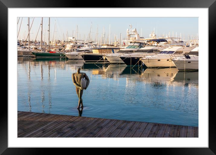 Urban sculpture 'The return of surfing Icarus'  Framed Mounted Print by Kevin Hellon