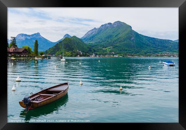 Boat on the lake of Annecy in the french Alps Framed Print by Laurent Renault