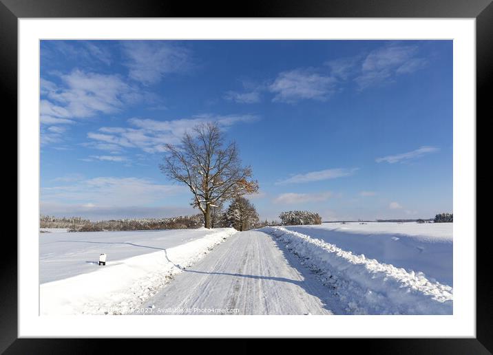 Road in the countryside after heavy snowfall in central Europe Framed Mounted Print by Sergey Fedoskin