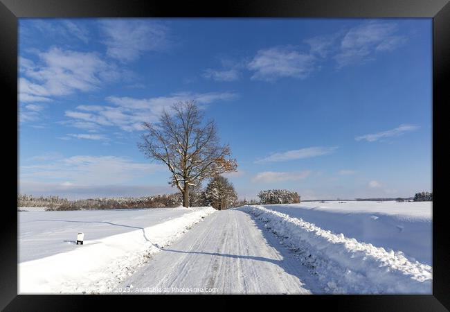 Road in the countryside after heavy snowfall in central Europe Framed Print by Sergey Fedoskin