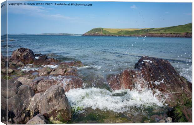 Sea waves crashing against the rocks on Manorbier Beach pembroke Canvas Print by Kevin White