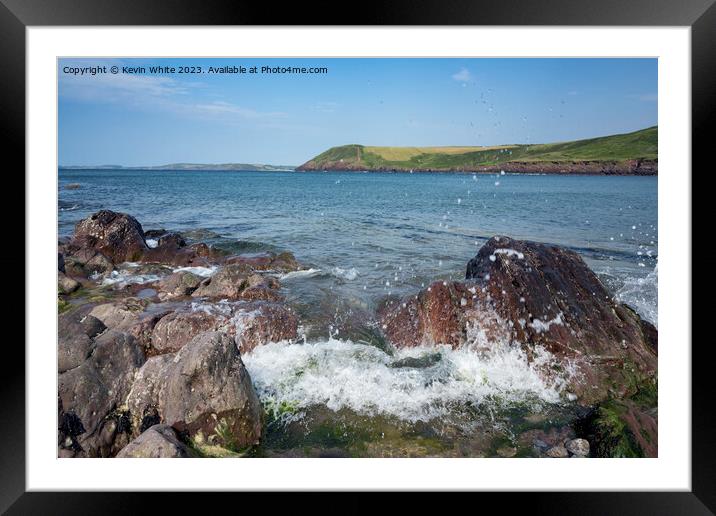 Sea waves crashing against the rocks on Manorbier Beach pembroke Framed Mounted Print by Kevin White