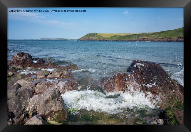 Sea waves crashing against the rocks on Manorbier Beach pembroke Framed Print by Kevin White