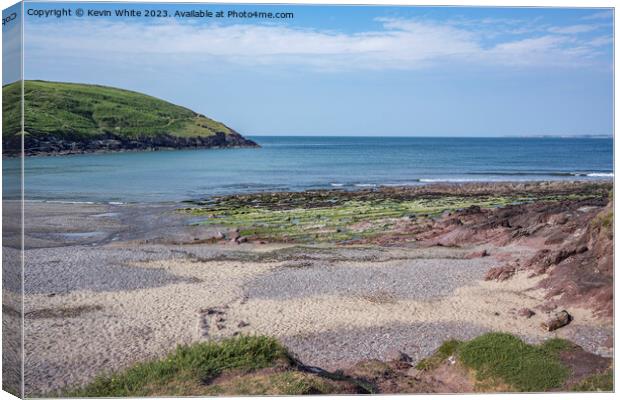 Sand and rocky beach at Manorbier South Wales Canvas Print by Kevin White