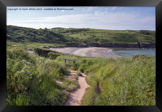 Cliff walk down to Manorbier Beach in South Wales Framed Print by Kevin White