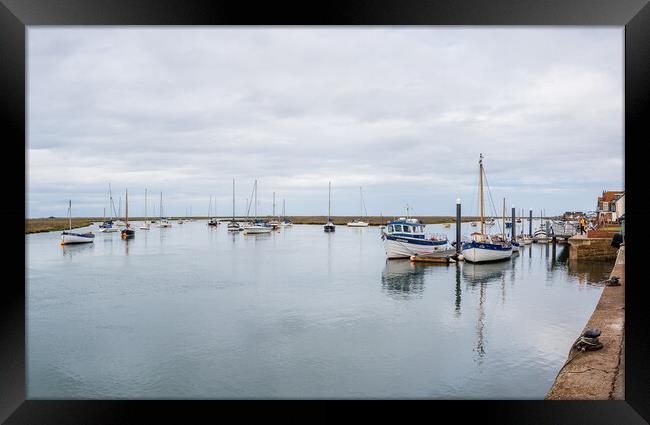 Boats on the calm water at Wells next the Sea Framed Print by Jason Wells