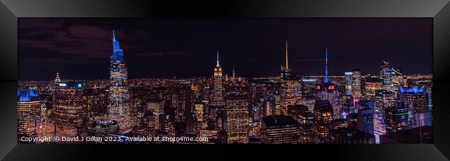 Manhattan Skyline at Night Framed Print by David J Gillan