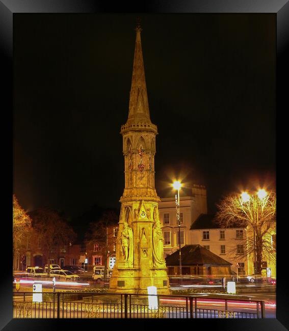 Banbury Cross at night Framed Print by Cliff Kinch