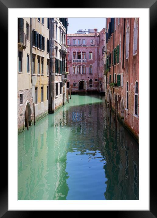 A narrow canal in Venice Italy Europe Framed Mounted Print by John Gilham