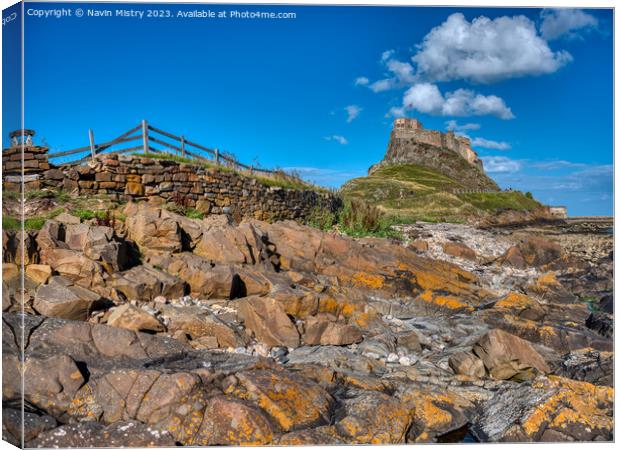 Lindisfarne Castle and Blue Skies Canvas Print by Navin Mistry