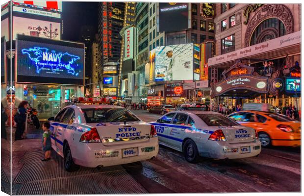 NYPD watch over Times Square.  Canvas Print by Alan Matkin