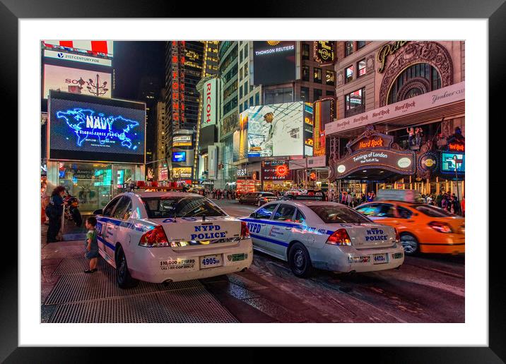 NYPD watch over Times Square.  Framed Mounted Print by Alan Matkin