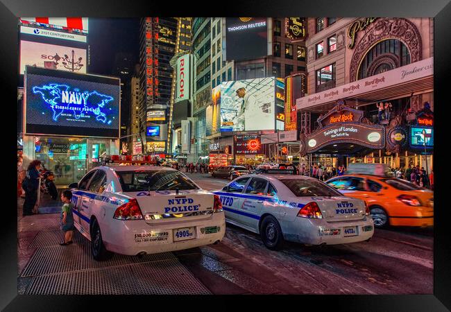 NYPD watch over Times Square.  Framed Print by Alan Matkin