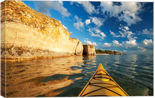 kayaking along limestone cliffs Canvas Print by Dave Reede
