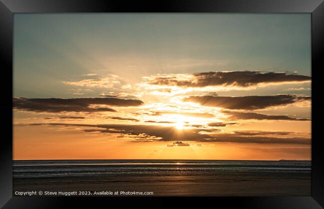 Sunset with  Rays bracking through the cloud at Pembrey Beach Wales Framed Print by Steve Huggett