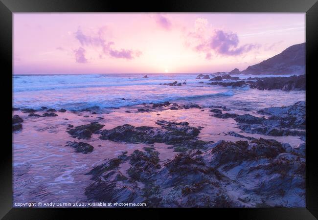 Serene Sunset Symphony: A Pink Horizon over Rocky Shores