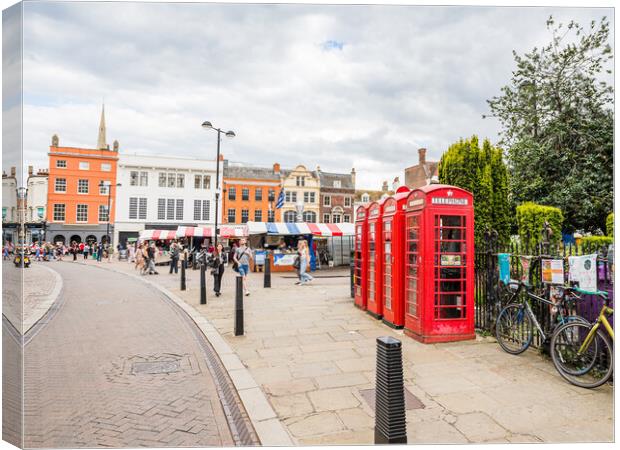 Red phone boxes next to Cambridge market Canvas Print by Jason Wells