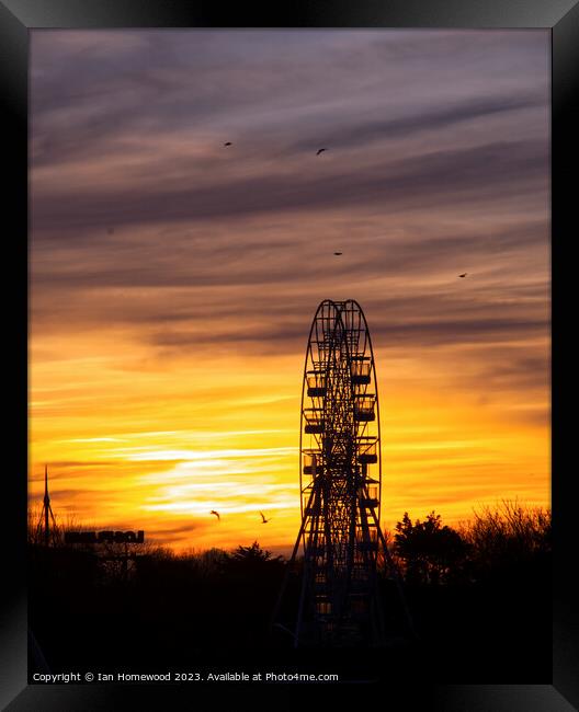 Big Wheel At Sunset Framed Print by Ian Homewood