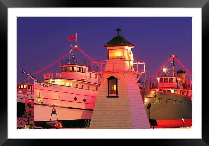 Christmas lights on ships and lighhouse Framed Mounted Print by Dave Reede