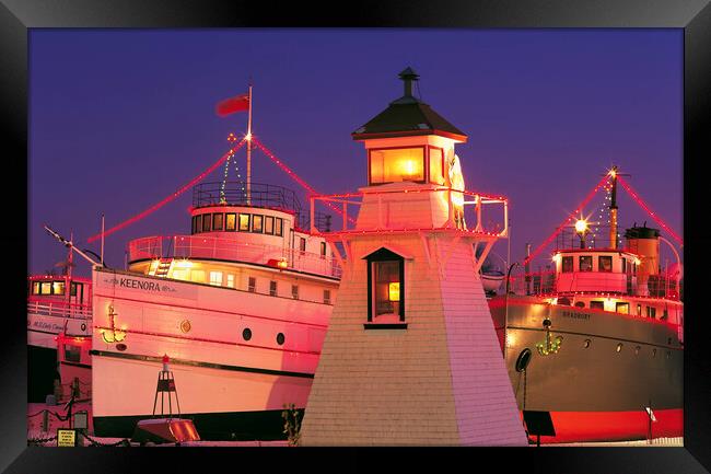 Christmas lights on ships and lighhouse Framed Print by Dave Reede