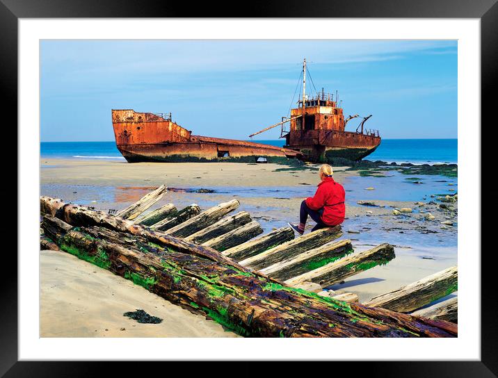 woman sitting on remains of wooden shipwreck viewing shipwreck Framed Mounted Print by Dave Reede