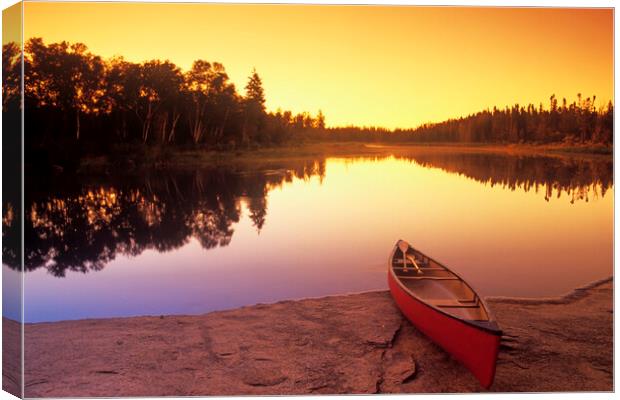 canoe along the Whiteshell River Canvas Print by Dave Reede