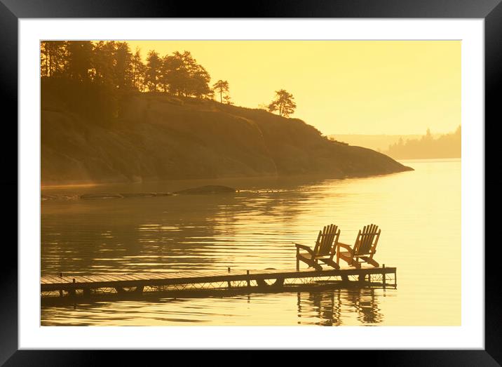 chair on dock,Big Whiteshell Lake Framed Mounted Print by Dave Reede