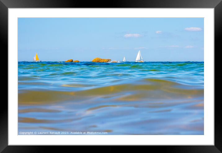 Boats and waves seen by a swimmer at sea level, photography take Framed Mounted Print by Laurent Renault