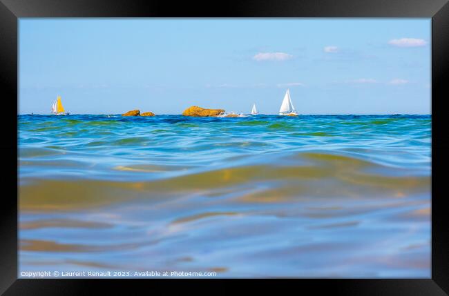 Boats and waves seen by a swimmer at sea level, photography take Framed Print by Laurent Renault