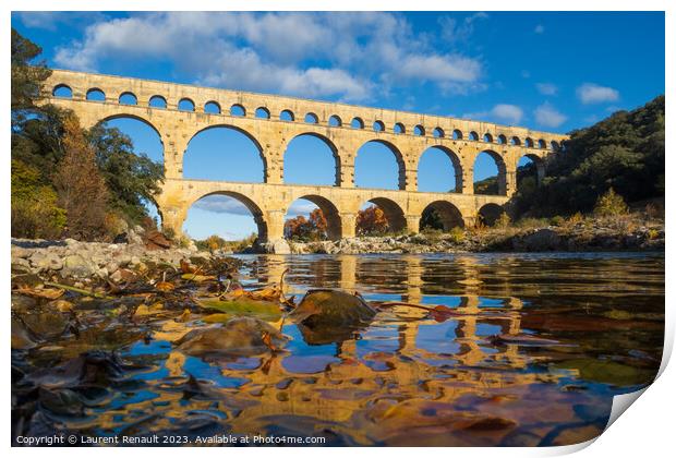 The Pont du Gard viewed from the river. Ancient Roman aqueduct b Print by Laurent Renault