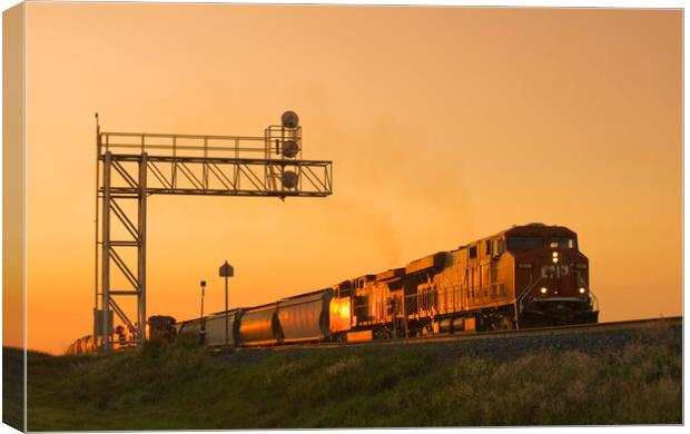 locomotives pulling rail hopper cars pass an overhead rail signal Canvas Print by Dave Reede
