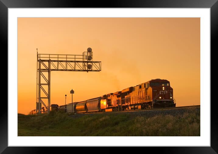 locomotives pulling rail hopper cars pass an overhead rail signal Framed Mounted Print by Dave Reede