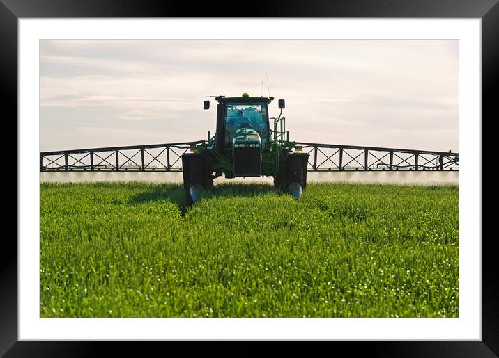 spraying wheat Framed Mounted Print by Dave Reede