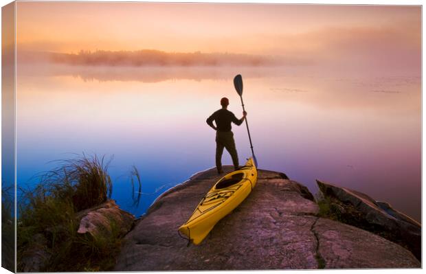 man with kayak Canvas Print by Dave Reede