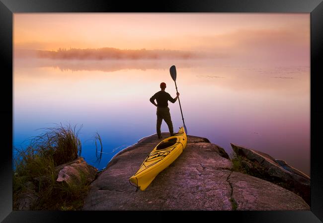 man with kayak Framed Print by Dave Reede