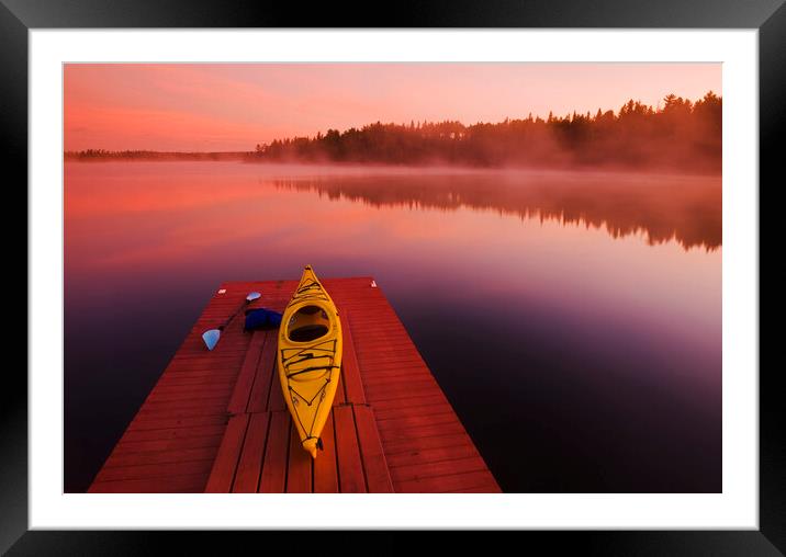 kayak on dock Framed Mounted Print by Dave Reede