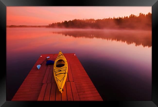 kayak on dock Framed Print by Dave Reede