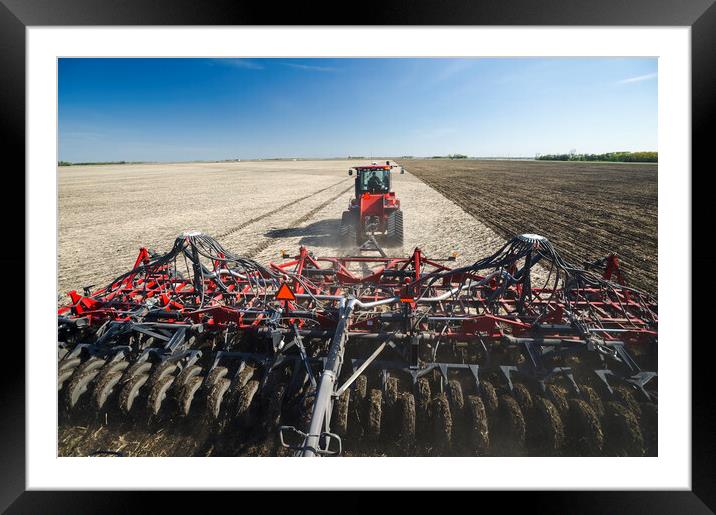 moving tractor and and air till seeder planting soybeans Framed Mounted Print by Dave Reede