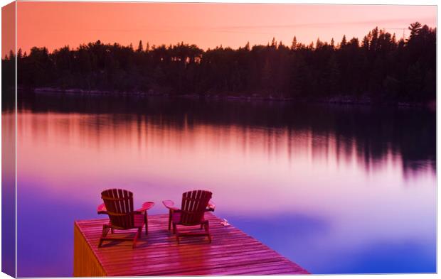 Muskoka chairs on dock Canvas Print by Dave Reede