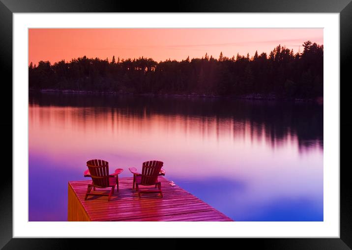 Muskoka chairs on dock Framed Mounted Print by Dave Reede