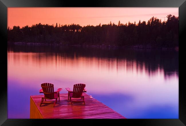 Muskoka chairs on dock Framed Print by Dave Reede