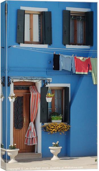 Colourful house on burano island Venice  Canvas Print by Les Schofield