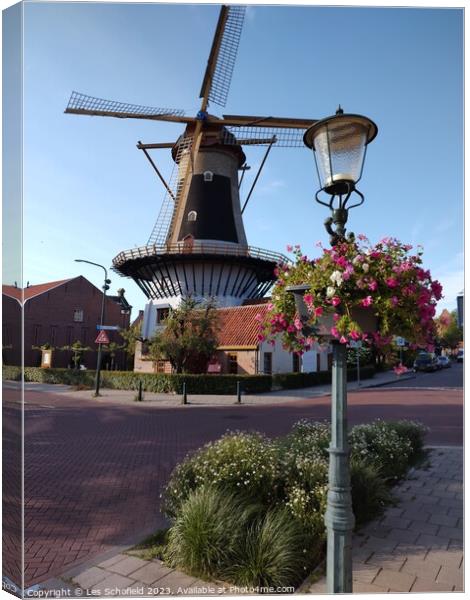 Windmill in wassaner Netherlands  Canvas Print by Les Schofield