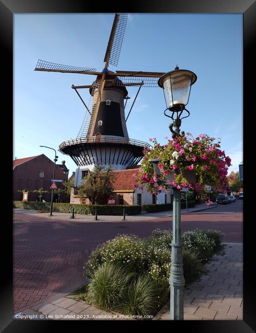 Windmill in wassaner Netherlands  Framed Print by Les Schofield
