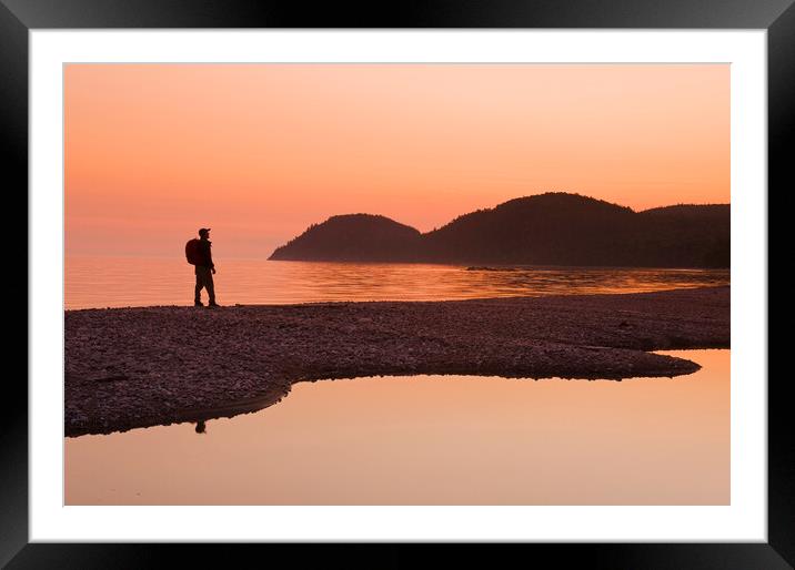 hiker along beach Framed Mounted Print by Dave Reede