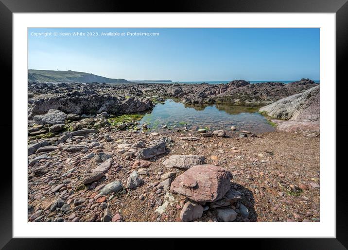 Calm rock pools on Freshwater West beach Pembrokeshire Framed Mounted Print by Kevin White