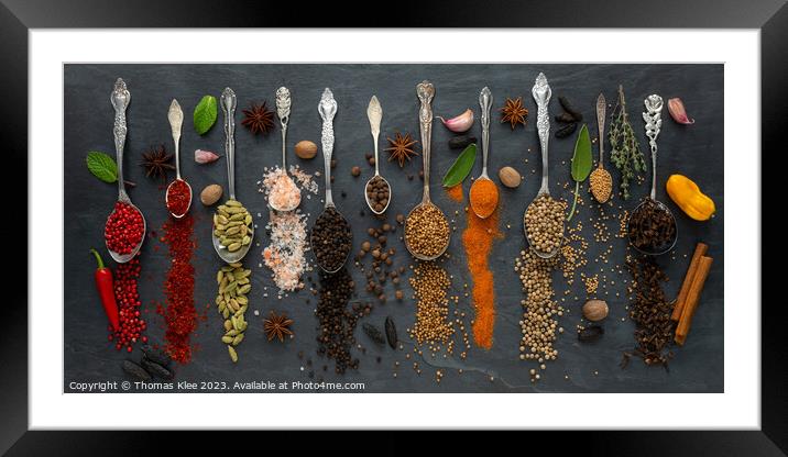 Colorful selection of exotic spices on a slate Framed Mounted Print by Thomas Klee