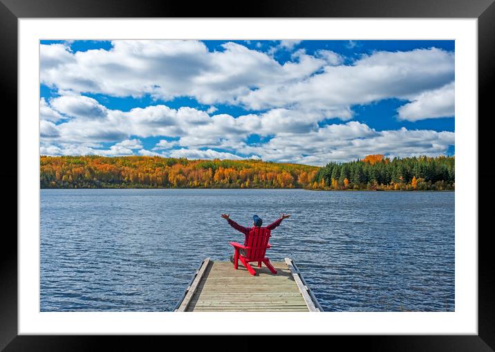man in chair on dock Framed Mounted Print by Dave Reede